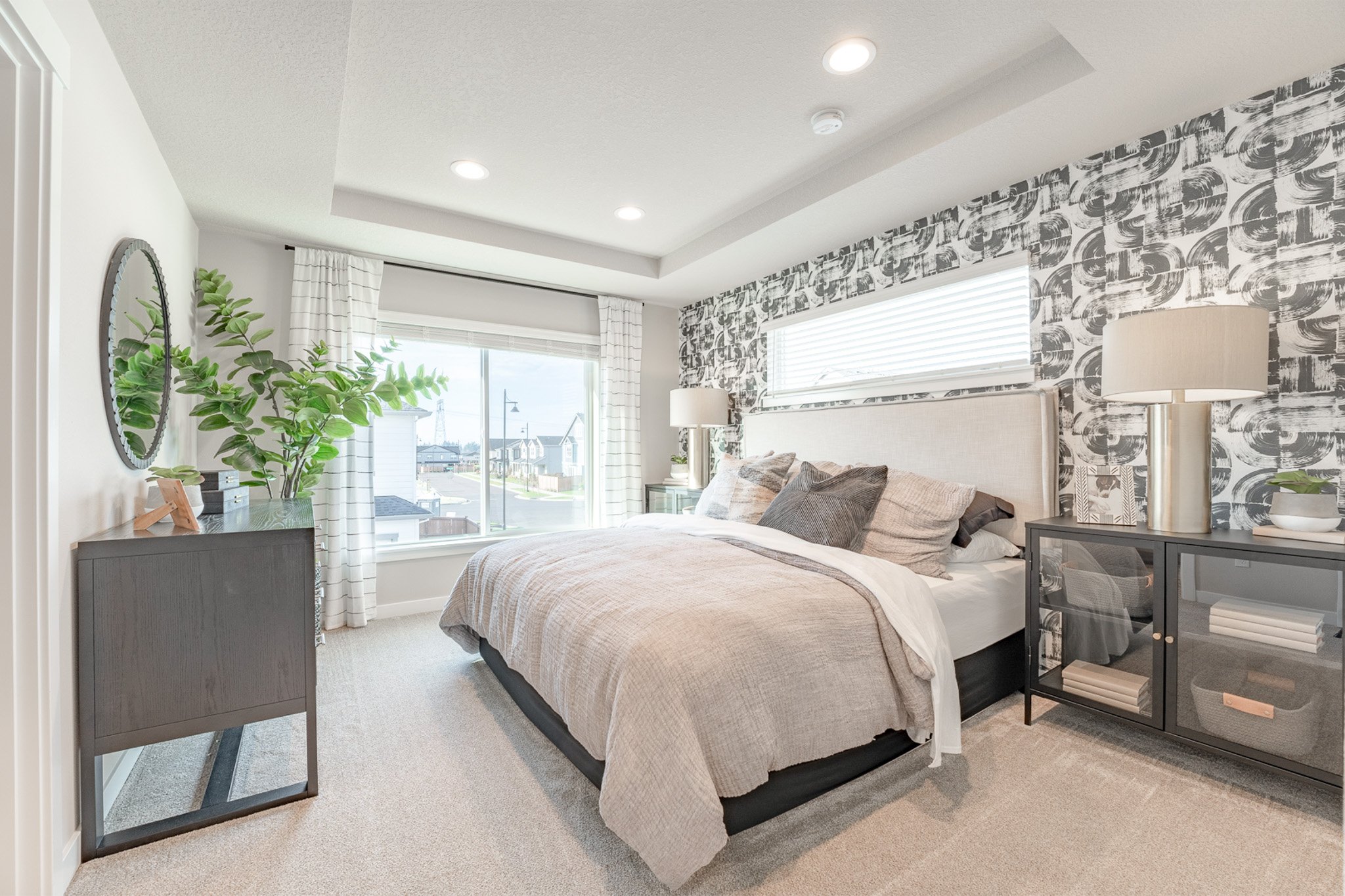 Bedroom with black and white artistic accent wall